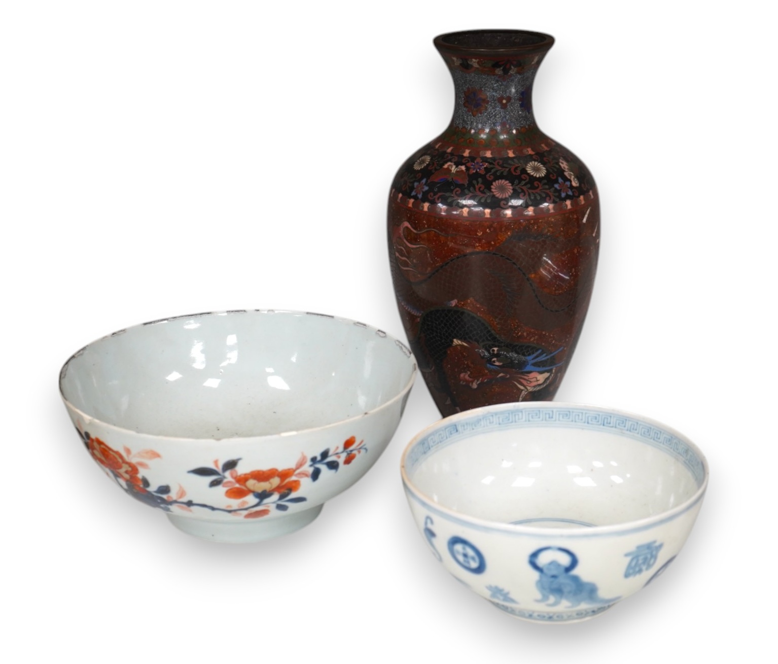 Three pieces of Chinese and Japanese ceramics to include an 18th century Chinese export bowl and a cloisonné ‘dragon’ vase, 31cm high. Condition - fair